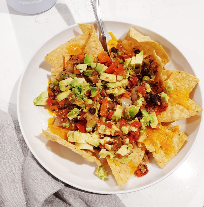 Tortilla chips with Southwest Quinoa and Black Beans topped with avocado